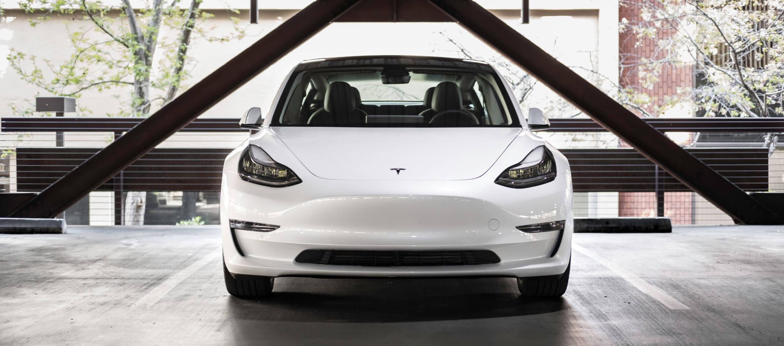 Automotive trends White Tesla Model 3 parked